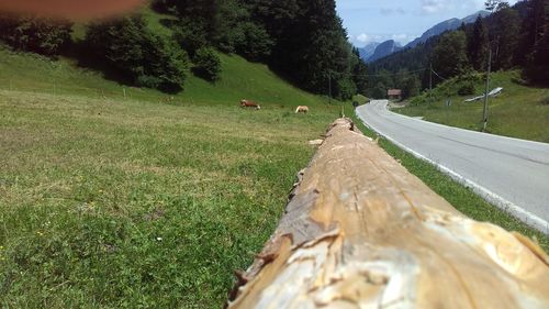 Empty road leading towards mountain