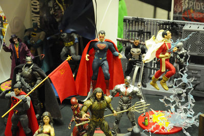 Close-up of figurine of toys for sale