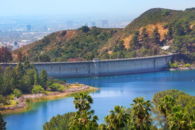 High angle view of dam by river against sky