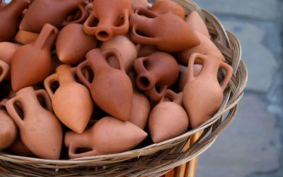 Close-up of amphora in bamboo basket