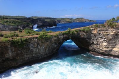 Scenic view of sea against blue sky