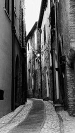 Alley amidst buildings in city