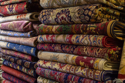 Full frame shot of stacked colorful blankets in store