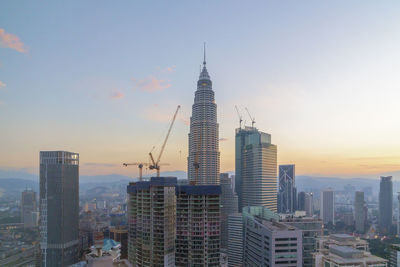 View of skyscrapers at sunset