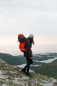 Rear view of woman walking on mountain