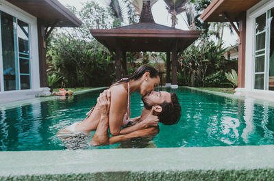 Friends enjoying in swimming pool