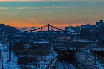 Snow covered bridge at dusk