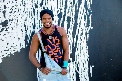 Portrait of young man standing outdoors