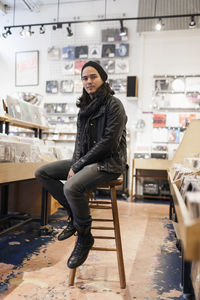 Young man browsing albums in a record store