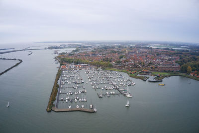 High angle view of enkhuizen harbour by ijsselmeer against sky