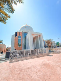 Low angle view of building against clear blue sky