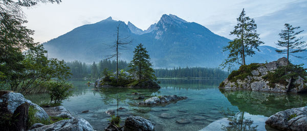 Scenic view of lake and mountains against sky