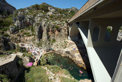 Bridge amidst buildings and mountains