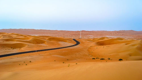 Scenic view of desert against clear sky