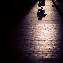Woman standing by railing