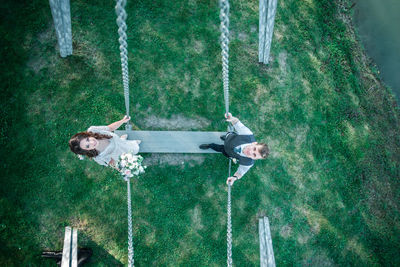 High angle view of swing hanging on playground