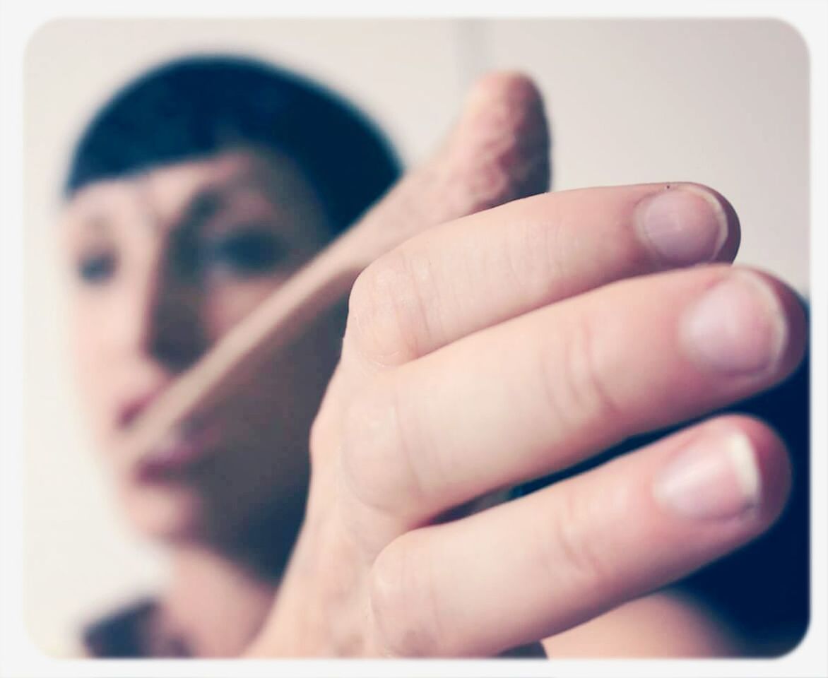 transfer print, auto post production filter, person, part of, indoors, holding, close-up, human finger, lifestyles, cropped, leisure activity, unrecognizable person, men, focus on foreground, personal perspective, showing