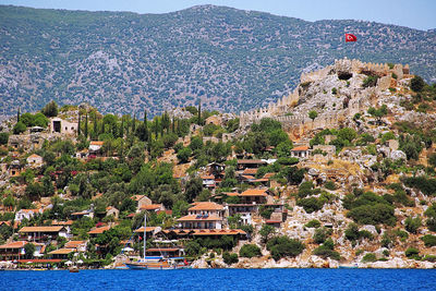 High angle view of buildings by sea