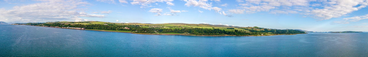 Panoramic view of bay against sky