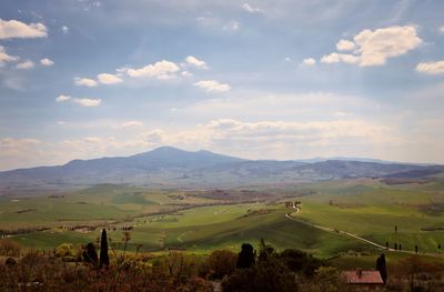 Scenic view of agricultural field against sky