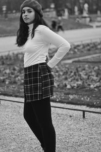 Portrait of teenage girl standing on walkway