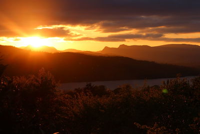 Scenic view of mountains against sky during sunset