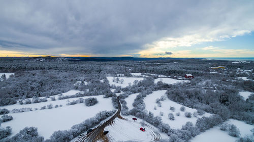 Snow covered field against sky