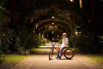 Man riding bicycle on footpath