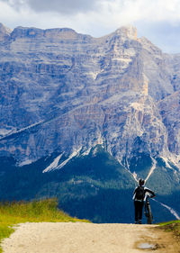 Rear view of man standing on mountain