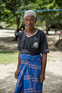 Portrait of a smiling man standing outdoors