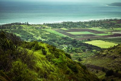 High angle view of landscape and sea against sky