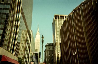 Low angle view of modern buildings against clear sky