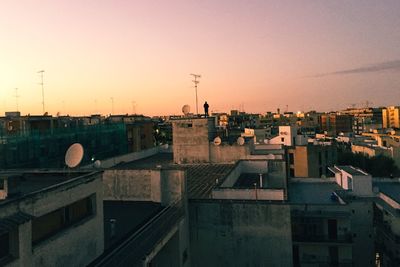 View of town against sky during sunset