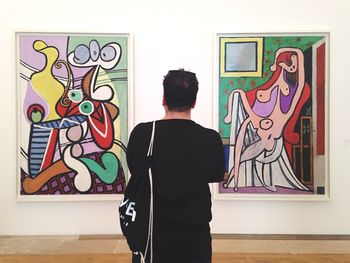 Woman standing against wall