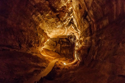 Low angle view of illuminated cave