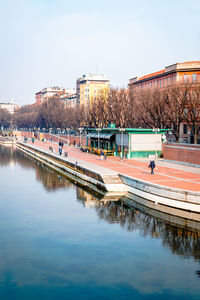 Milan, navigli, darsena, people walking on a sunny winter day