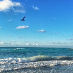 Scenic view of sea against cloudy sky