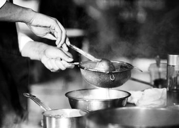 Midsection of person preparing food