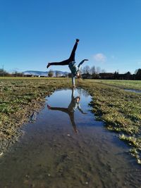 Reflections over a puddle