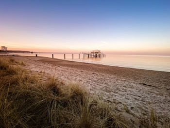 Scenic view of beach against clear sky