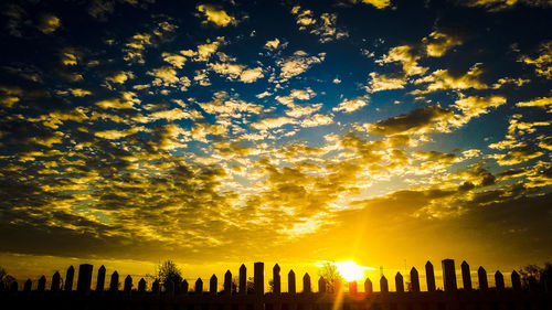 Low angle view of silhouette trees against sky during sunset