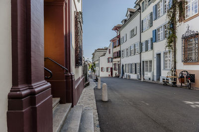 Street amidst buildings in city against sky