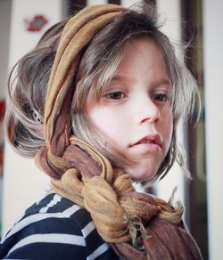 Close-up of girl with braided headscarf