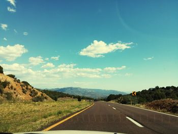 Country road passing through landscape