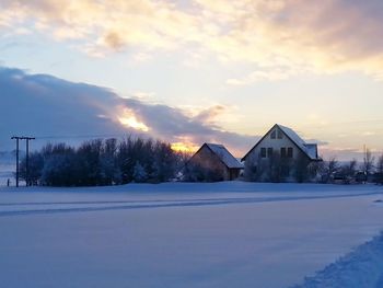 Houses on snow covered landscape