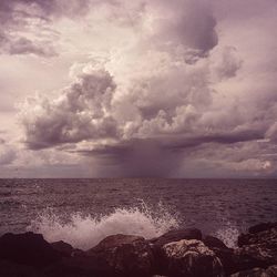 Scenic view of sea against cloudy sky