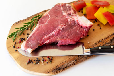 High angle view of meat on cutting board