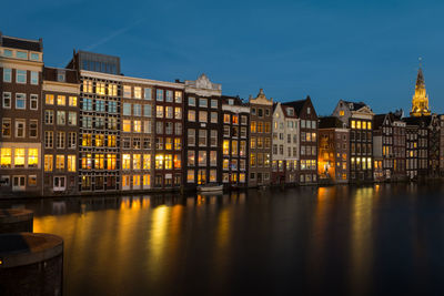 Reflection of buildings in city at night