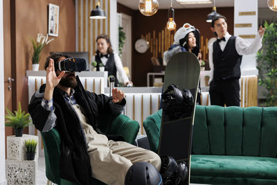 Rear view of woman using mobile phone