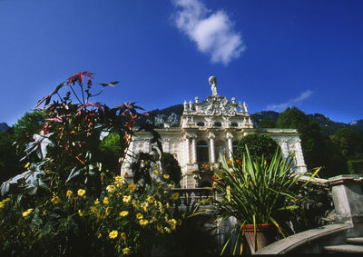Low angle view of built structure against blue sky